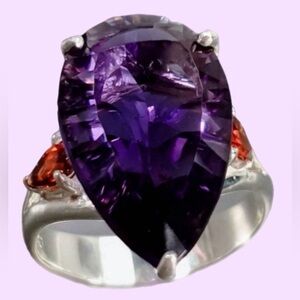 Elegant & sophisticated 12 CTW Genuine Amethyst Ring flanked by Genuine Garnets